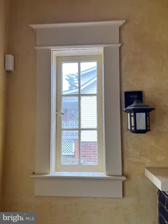 a view of a kitchen with stove and cabinets