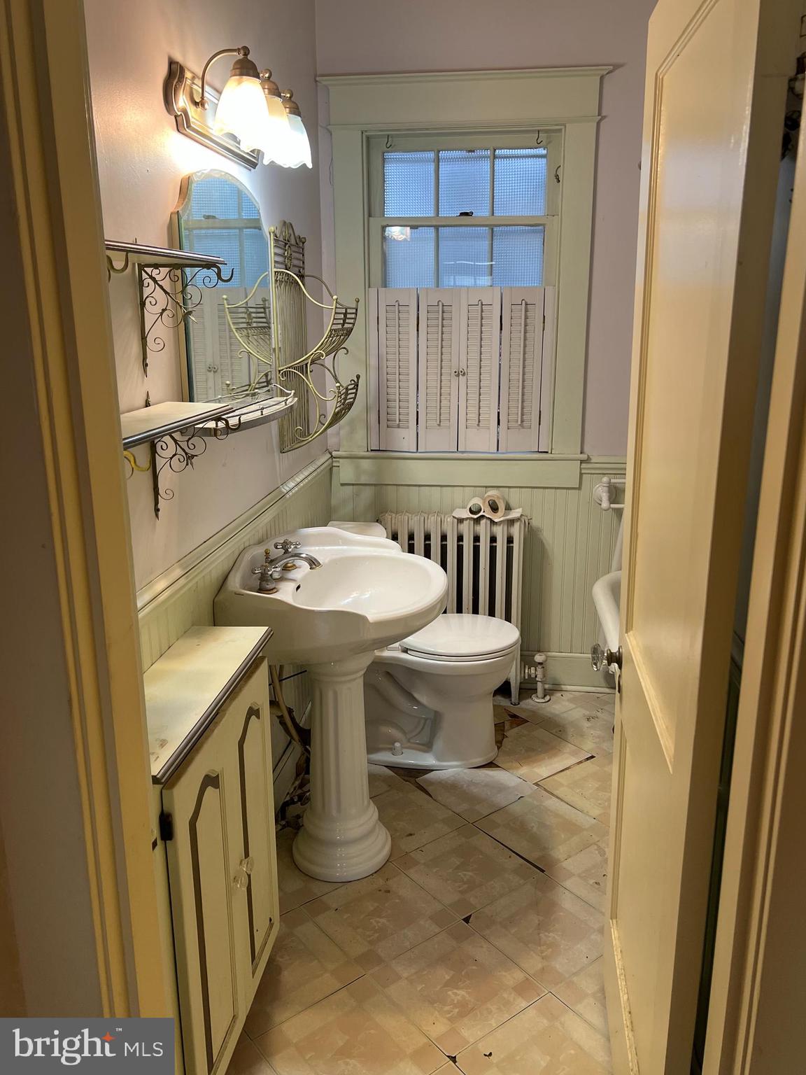 736 Easley Street Silver Spring, MD 20910 - Photo 35 of 51 a bathroom with a sink a toilet and a mirror