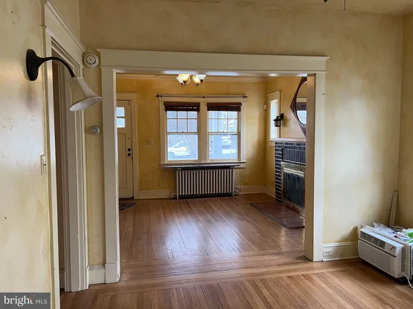 a view of an entryway with wooden floor