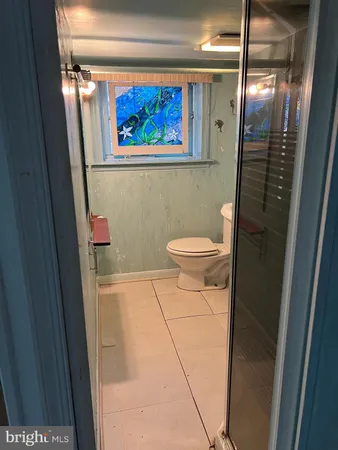 a bathroom with a toilet and a sink