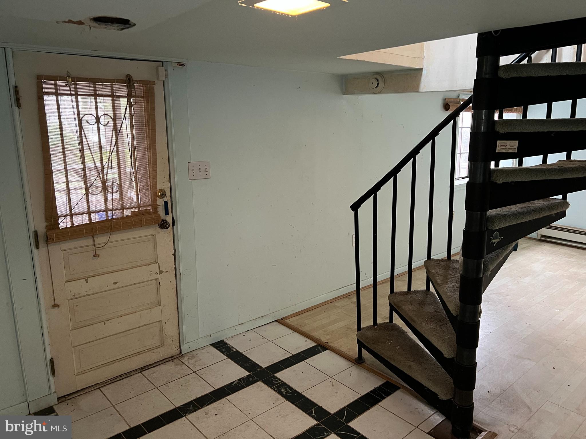 736 Easley Street Silver Spring, MD 20910 - Photo 47 of 51 a view of staircase with lots of frames on wall