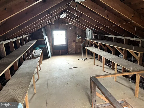 a view of an empty room with stairs