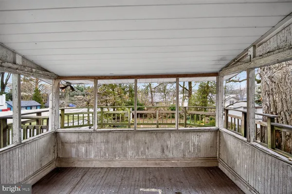 a view of a porch and garden