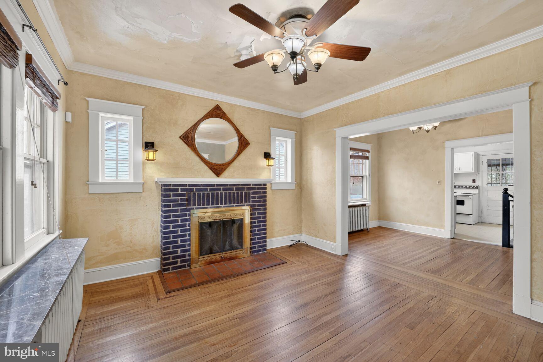 736 Easley Street Silver Spring, MD 20910 - Photo 8 of 51 a view of an empty room with a fireplace and a window