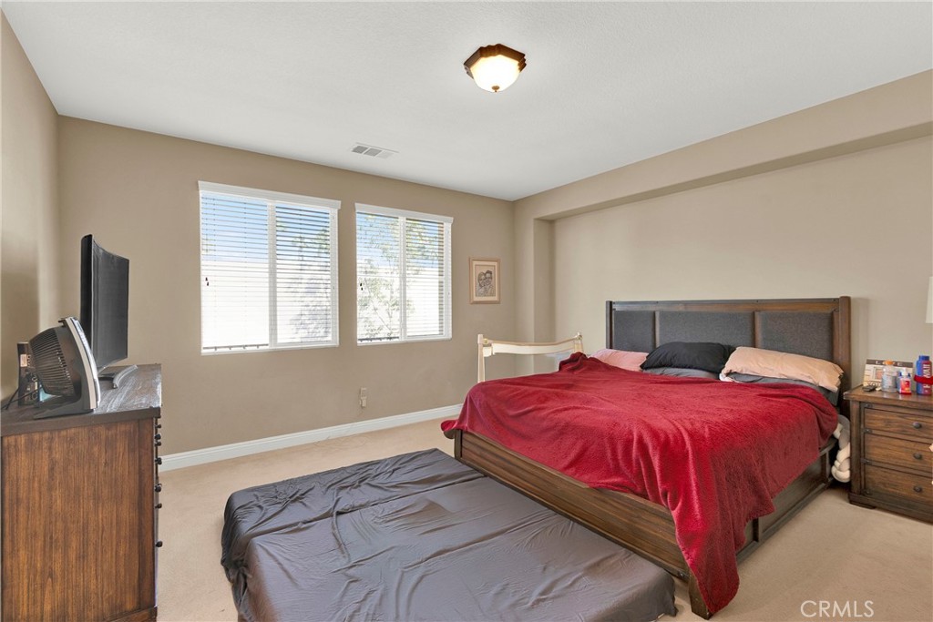 2 Sevilla Rancho Santa Margarita, CA 92688 - Photo 13 of 32 a bedroom with a bed and flat screen tv
