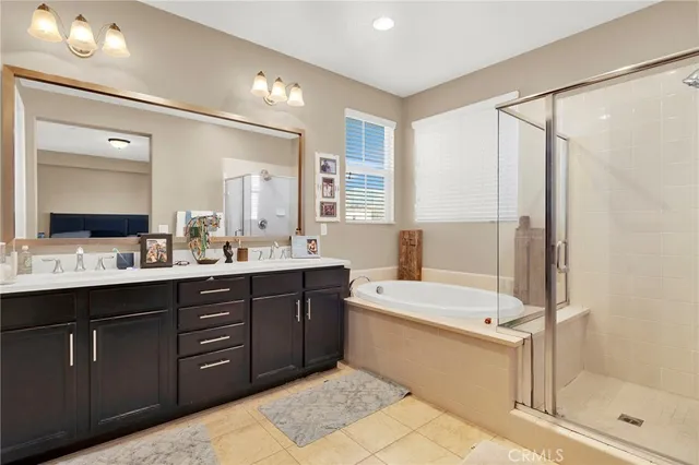 a bathroom with a granite countertop sink a toilet and shower