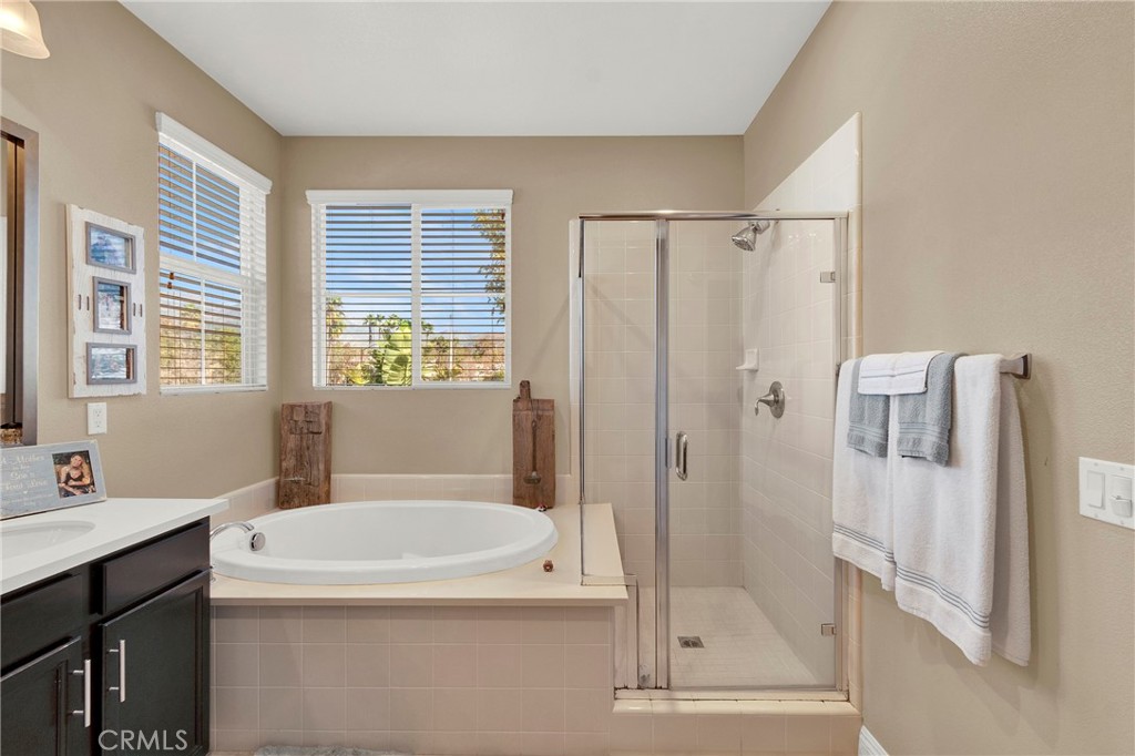 2 Sevilla Rancho Santa Margarita, CA 92688 - Photo 17 of 32 a bathroom with a granite countertop sink a toilet and shower
