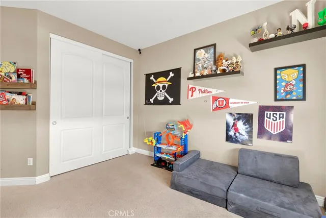 a bathroom with a shower sink vanity mirror and toilet