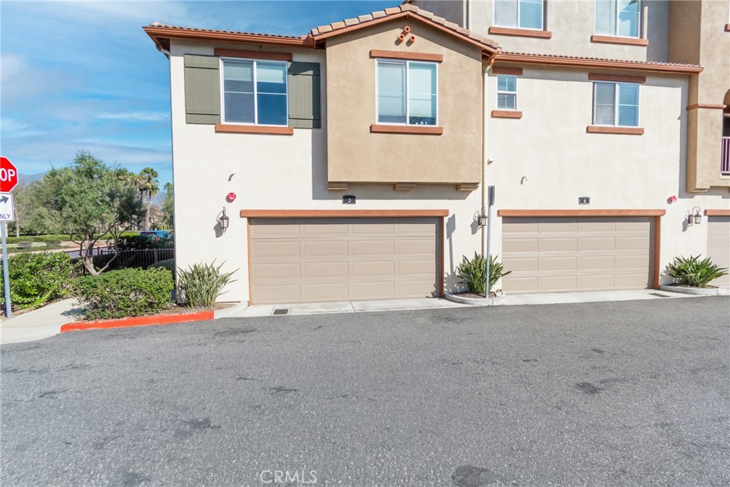 2 Sevilla Rancho Santa Margarita, CA 92688 - Photo 31 of 32 a front view of a house with a yard and a garage