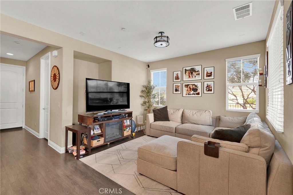 2 Sevilla Rancho Santa Margarita, CA 92688 - Photo 5 of 32 a living room with furniture and a flat screen tv