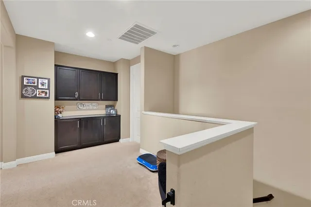 a kitchen with stainless steel appliances a refrigerator and a stove top oven