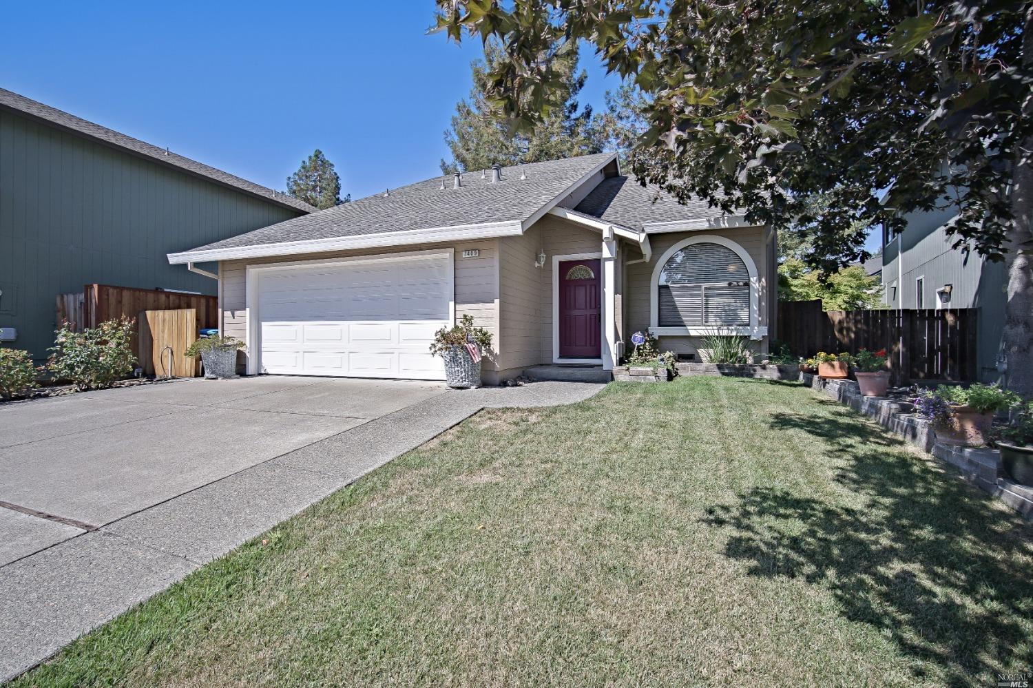 7409 Maximillian Place Rohnert Park, CA 94928 - Photo 1 of 1 a front view of a house with garden