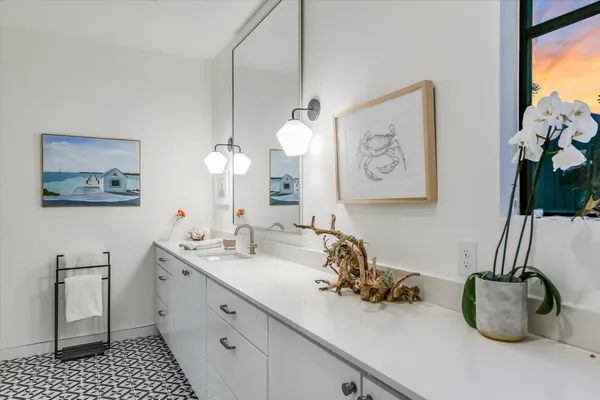 a bathroom with a sink and a mirror