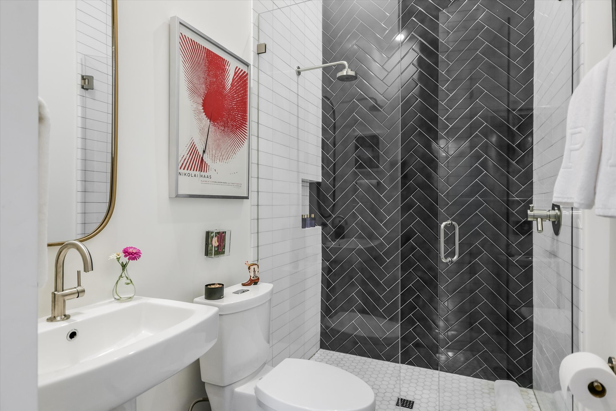 2212 South 2nd Street, Unit 2 Austin, TX 78704 - Photo 17 of 23 a bathroom with a sink toilet and shower