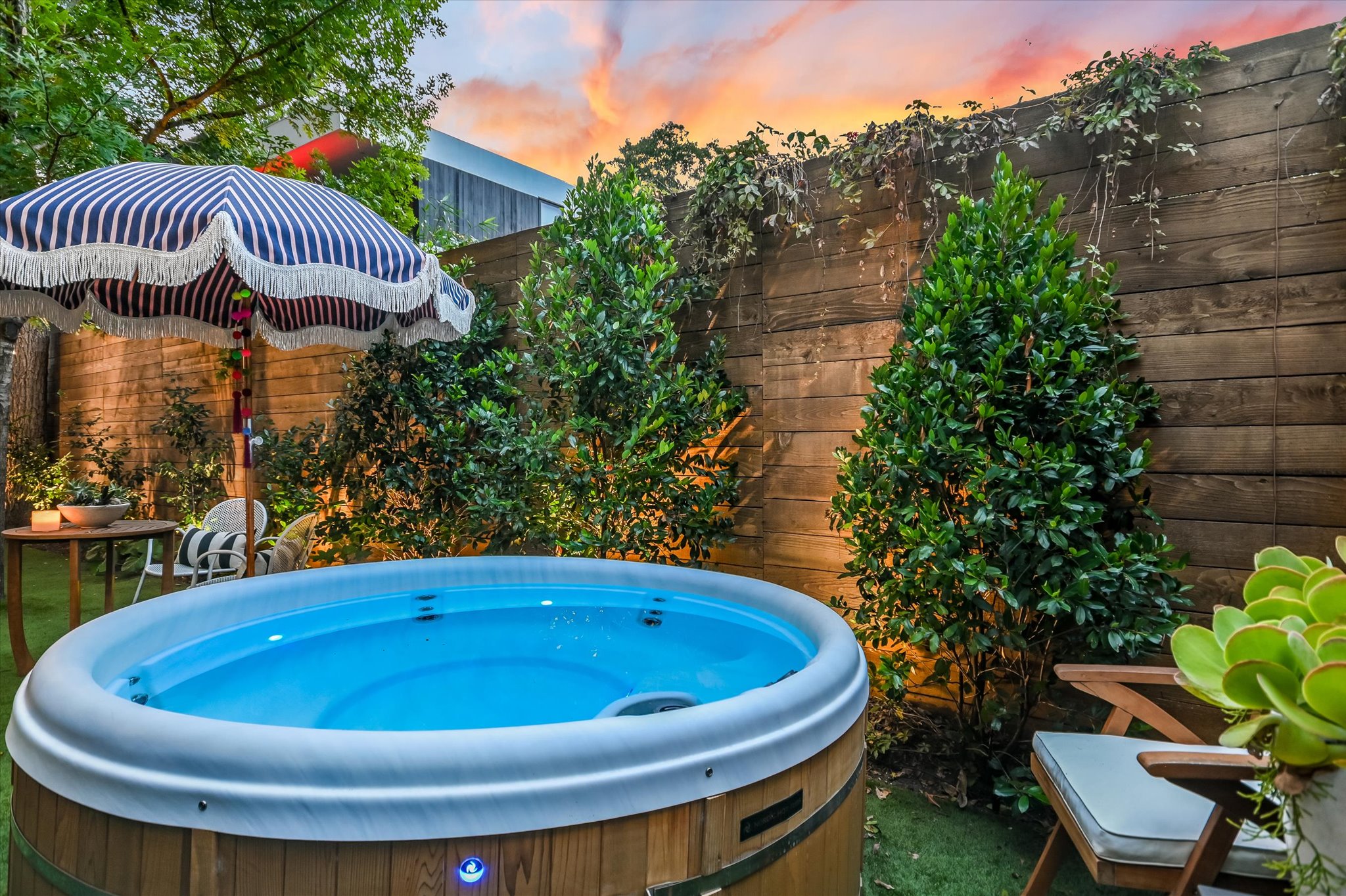 2212 South 2nd Street, Unit 2 Austin, TX 78704 - Photo 19 of 23 a view of a swimming pool with lawn chairs and potted plants