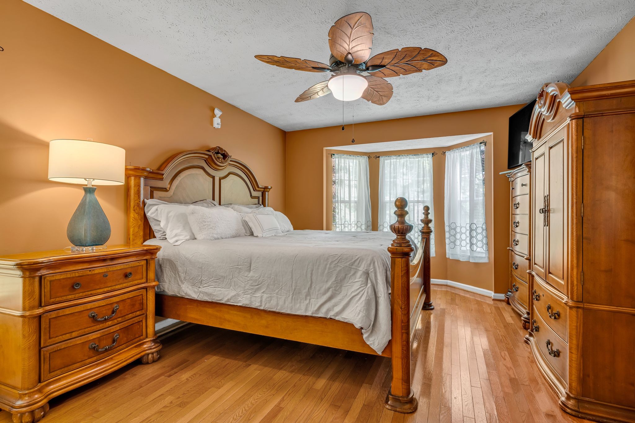 190 Gaskins Road Dickson, TN 37055 - Photo 12 of 25 a bedroom with a bed and wooden floor