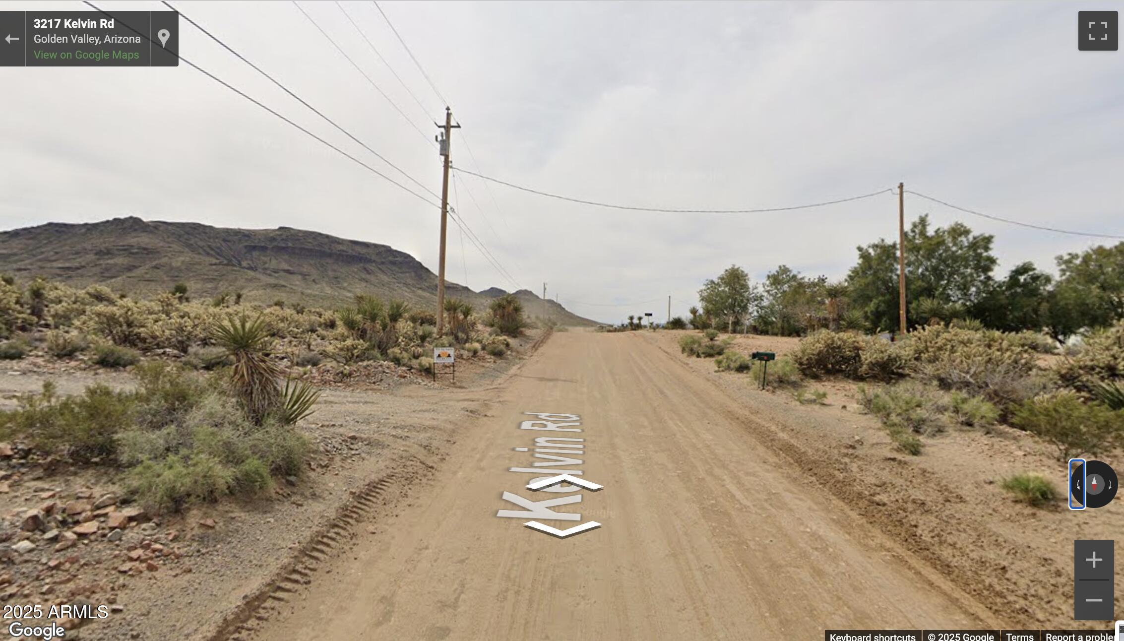 3217 Kelvin Road, Unit 1 Golden Valley, AZ 86413 - Photo 7 of 8 a view of a road with mountain view