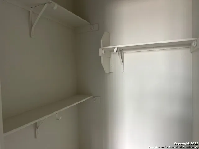 a view of a room with racks on the wall