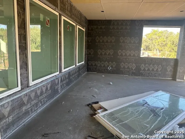a view of a yard in front of a house with a tree