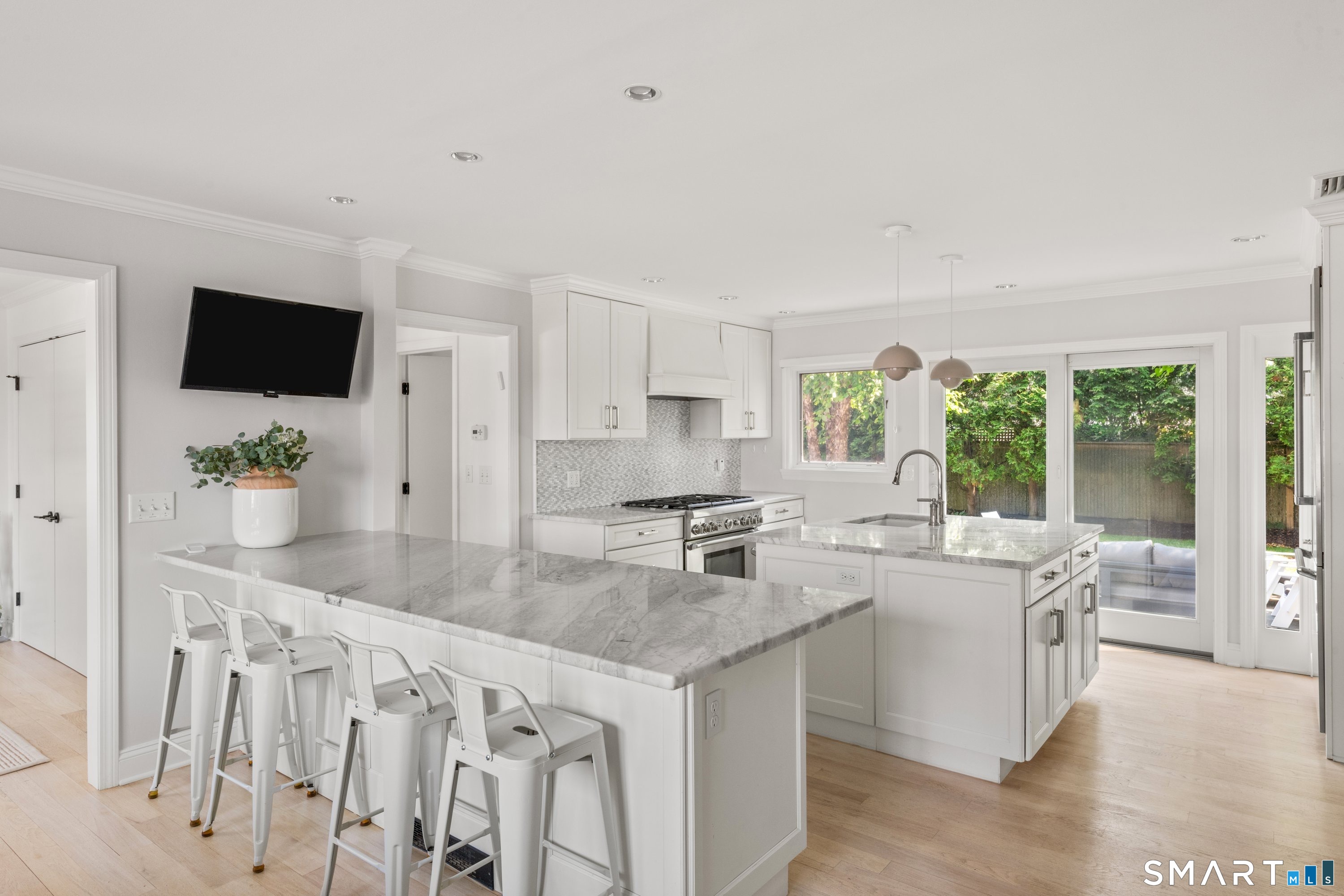 108 Harbor Road Westport, CT 06880 - Photo 5 of 25 a kitchen with granite countertop a sink and a stove top oven