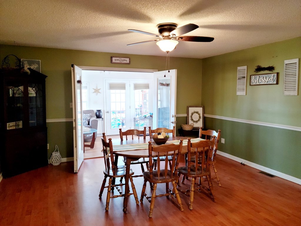 493 Northridge Drive Decatur, TN 37322 - Photo 19 of 43 a view of a dining room with furniture window and wooden floor