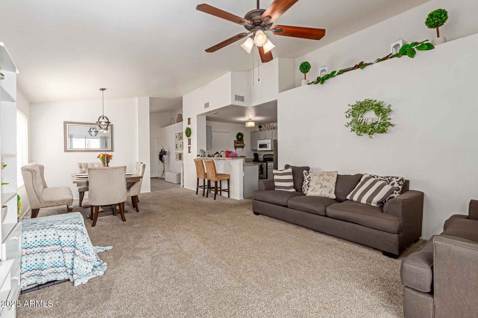 5008 Casper Road Mesa, AZ 85205 - Photo 11 of 25 a living room with furniture and a chandelier