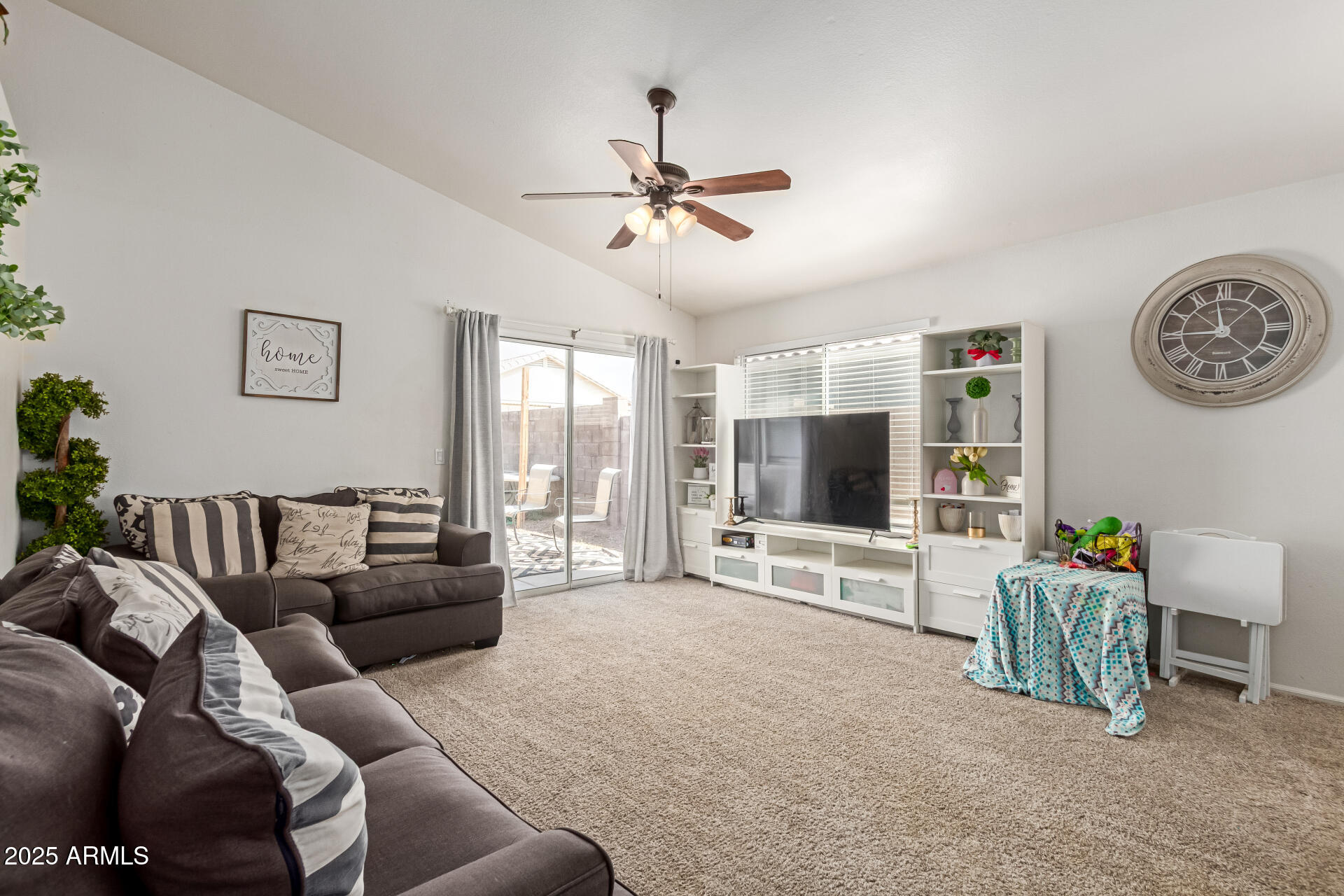 5008 Casper Road Mesa, AZ 85205 - Photo 14 of 25 a living room with furniture and a flat screen tv