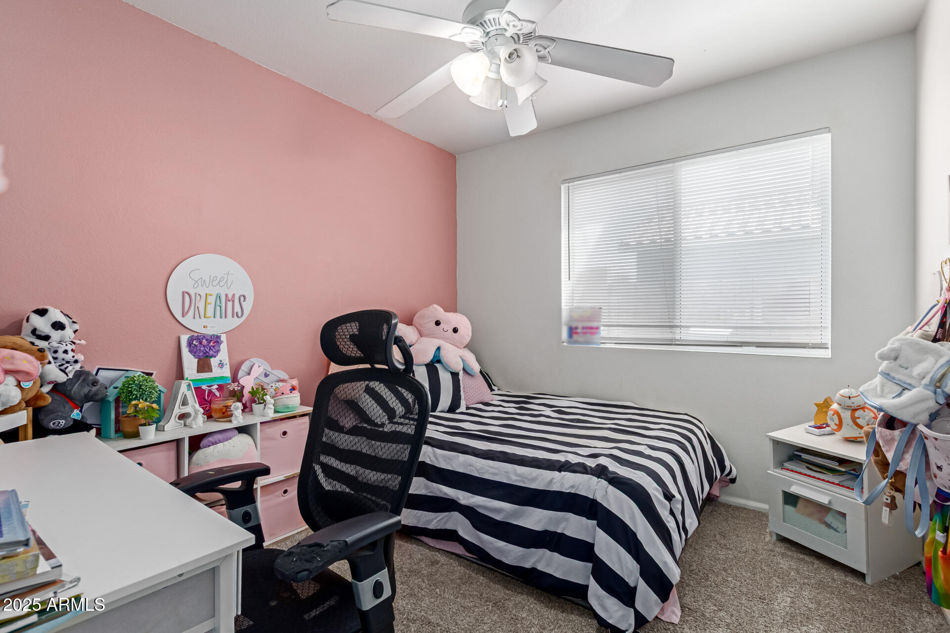 5008 Casper Road Mesa, AZ 85205 - Photo 18 of 25 a bedroom with a bed and a chandelier