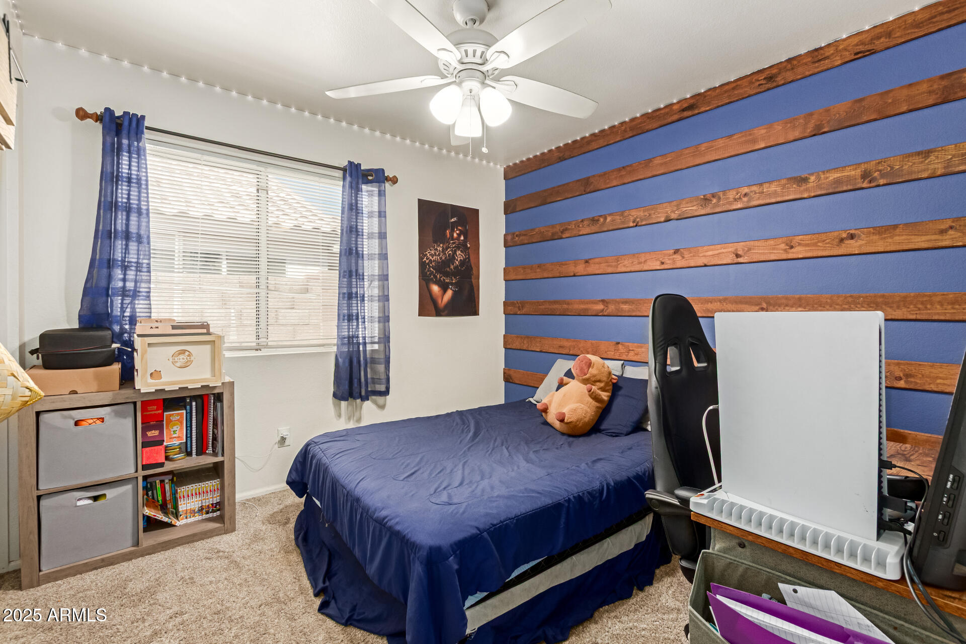 5008 Casper Road Mesa, AZ 85205 - Photo 19 of 25 a bedroom with a bed and a chandelier
