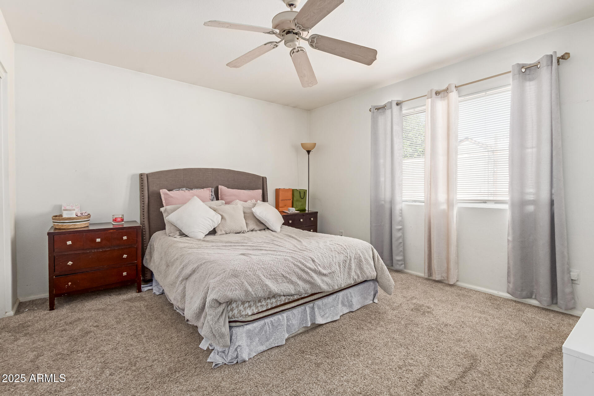 5008 Casper Road Mesa, AZ 85205 - Photo 21 of 25 a spacious bedroom with a bed and window