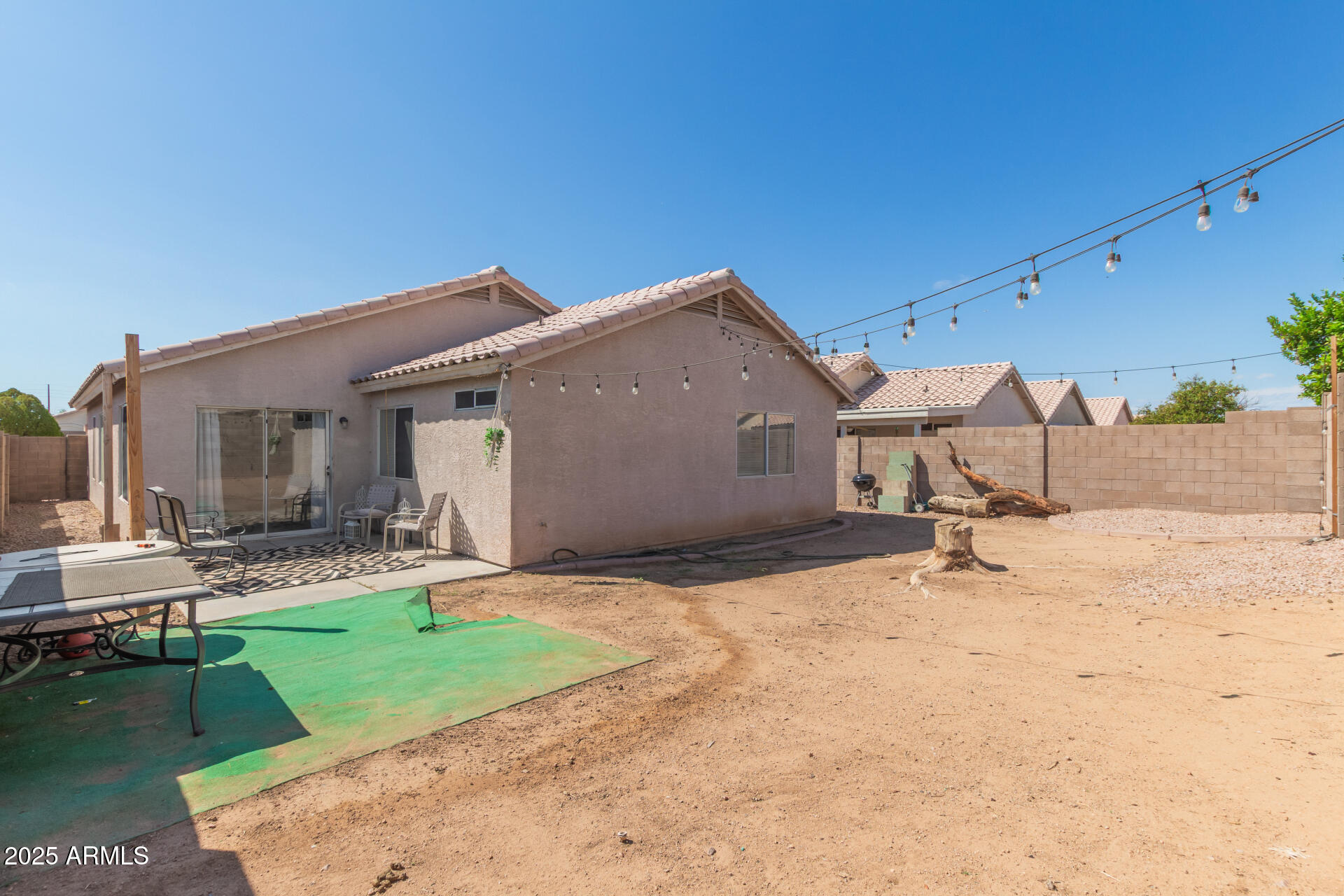 5008 Casper Road Mesa, AZ 85205 - Photo 24 of 25 a backyard of a house with yard and garage
