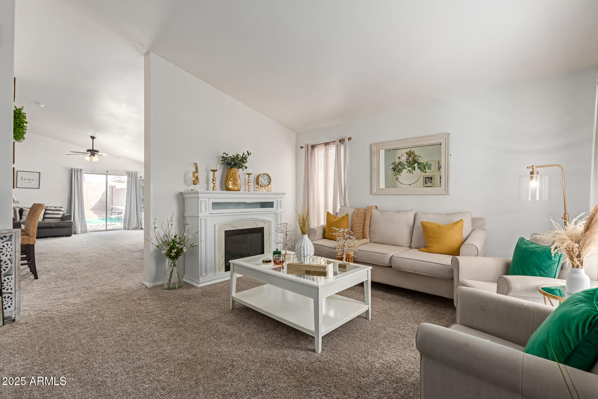 5008 Casper Road Mesa, AZ 85205 - Photo 5 of 25 a living room with furniture and a fireplace