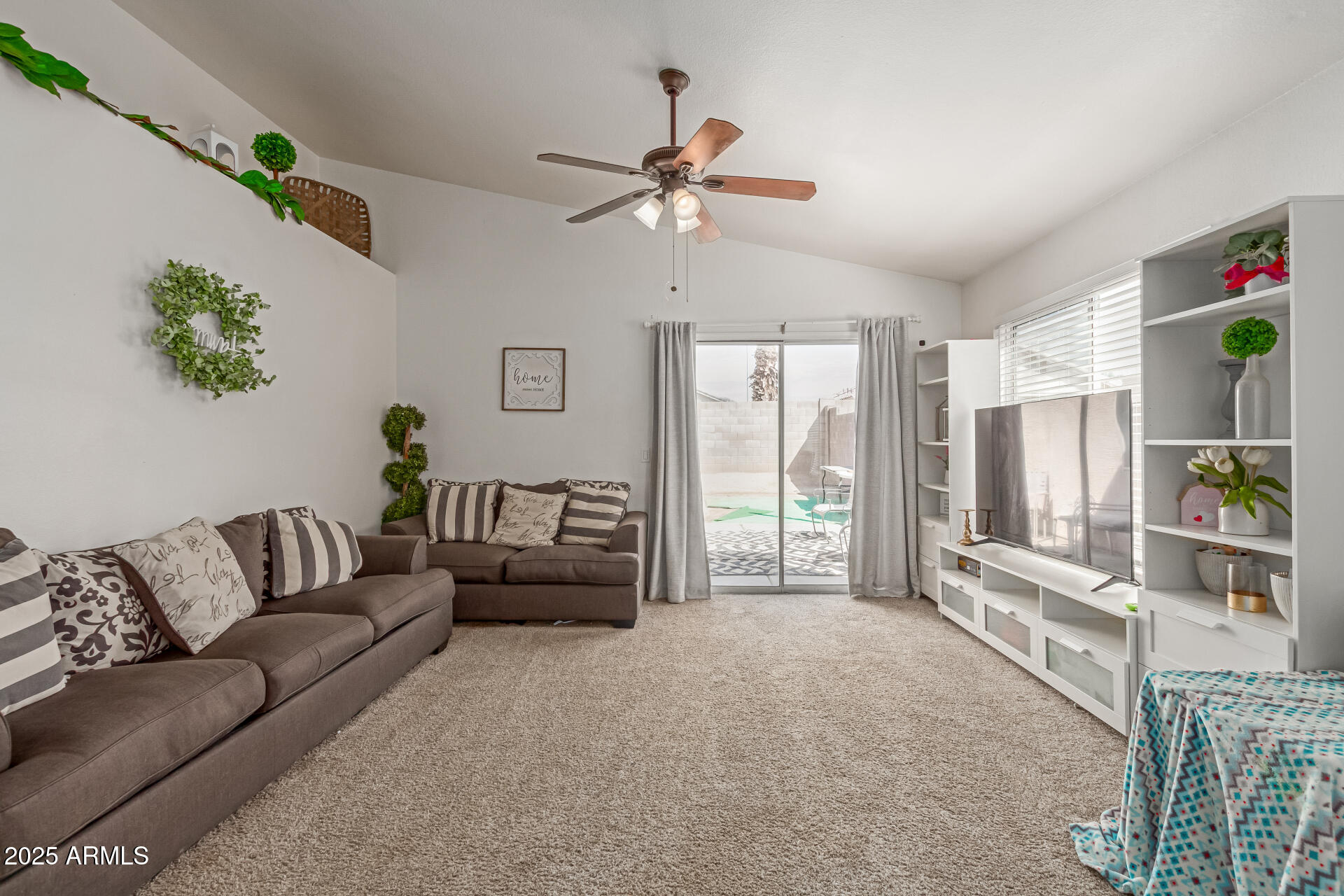 5008 Casper Road Mesa, AZ 85205 - Photo 10 of 25 a living room with furniture and a flat screen tv