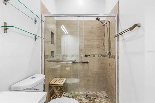 a bedroom with two beds and a large window