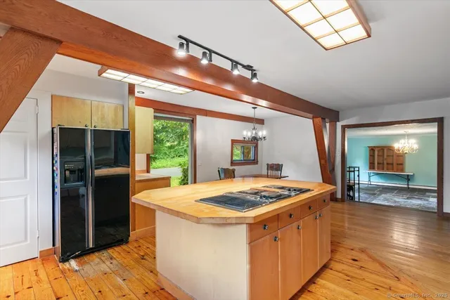 a kitchen that has a lot of cabinets in it