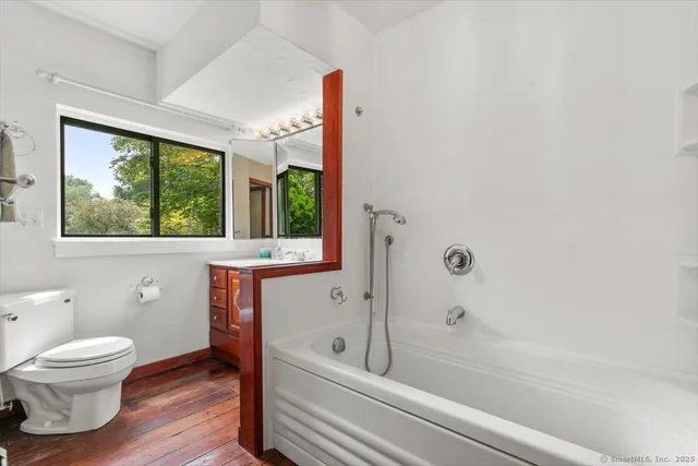 a bathroom with a toilet a sink and a bathtub
