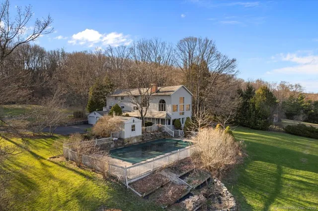 a view of a lake in middle of the mountain