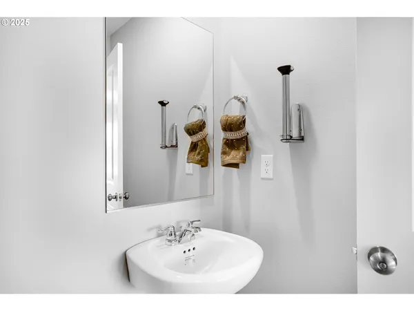 a bathroom with a sink and mirror