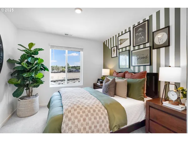 a bedroom with furniture and a potted plant