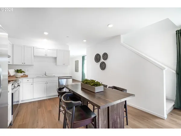 a kitchen with a table and chairs