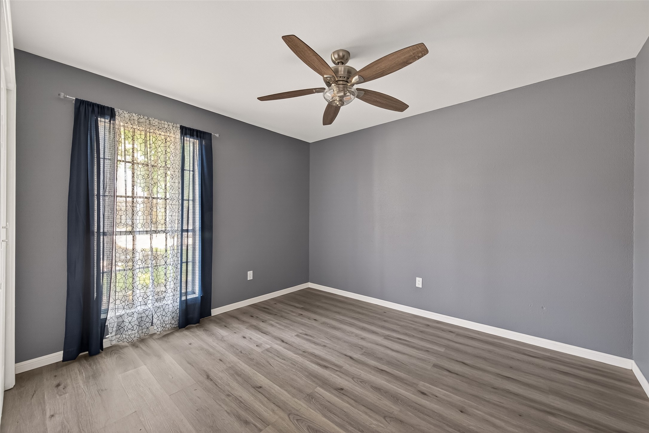24006 Lone Elm Drive Spring, TX 77373 - Photo 13 of 25 Secondary bedroom 2 also has a ceiling fan