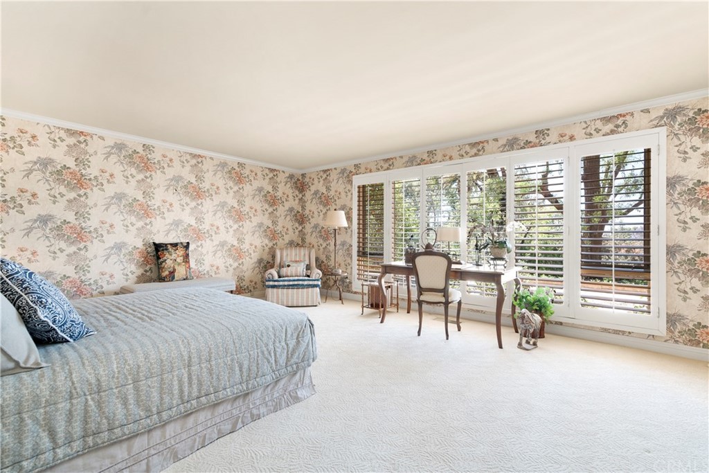 6800 Hawarden Drive Riverside, CA 92506 - Photo 24 of 57 a bedroom with furniture and a large window