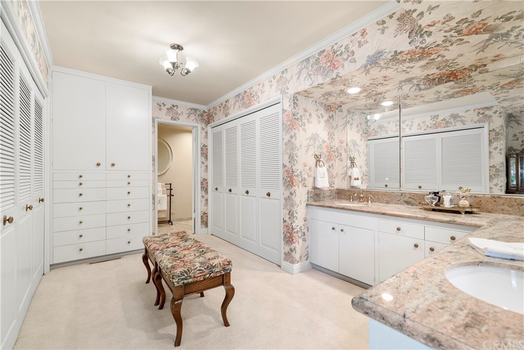 6800 Hawarden Drive Riverside, CA 92506 - Photo 28 of 57 a spacious bathroom with a granite countertop sink a toilet a mirror and shower