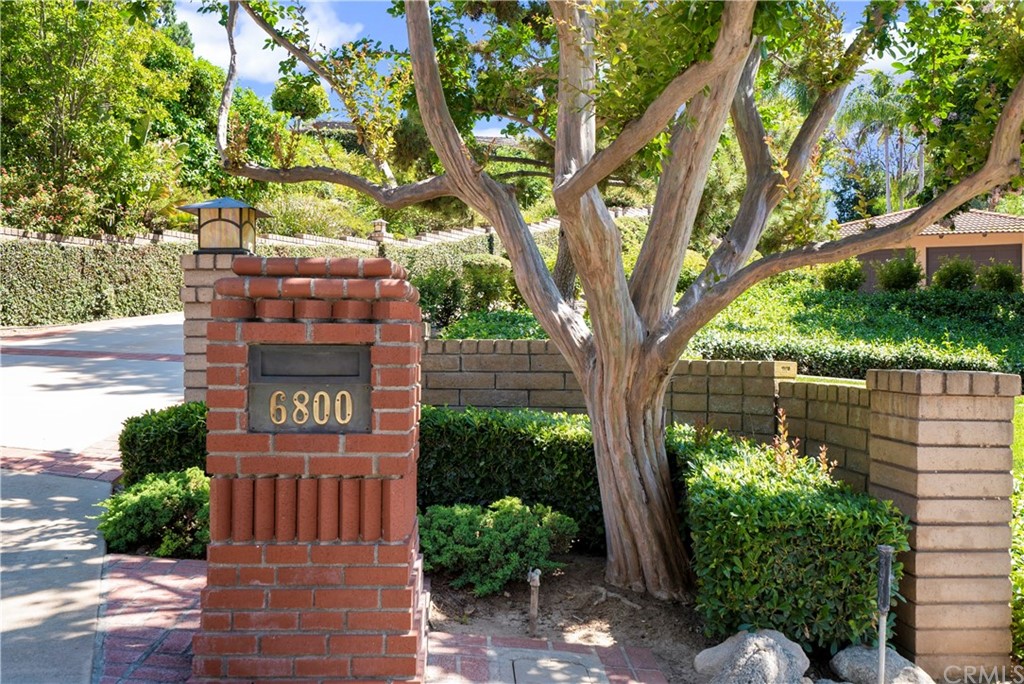 6800 Hawarden Drive Riverside, CA 92506 - Photo 50 of 57 a sign that is sitting in front of a tree