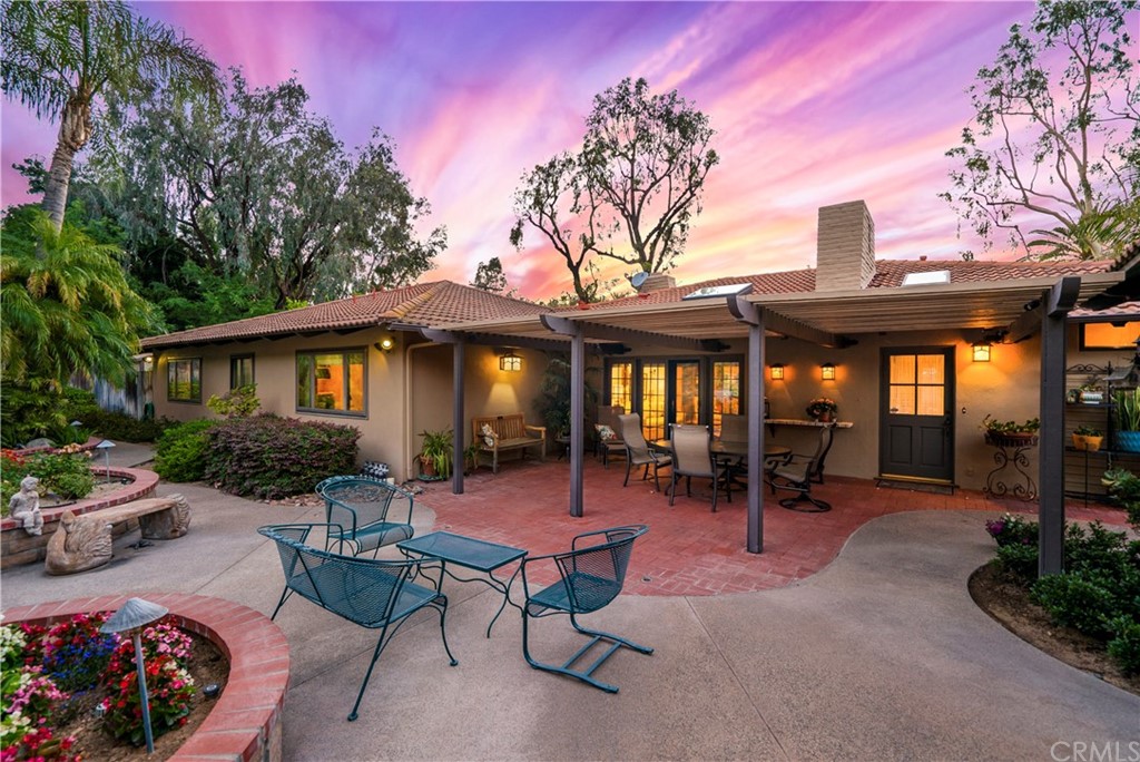 6800 Hawarden Drive Riverside, CA 92506 - Photo 54 of 57 a view of a patio with a table and chairs under an umbrella