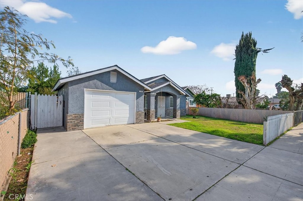 705 South C Madera, CA 93638 - Photo 11 of 50 a front view of house with yard and green space