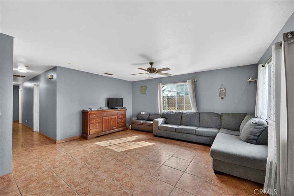 705 South C Madera, CA 93638 - Photo 15 of 50 a living room with furniture and a window