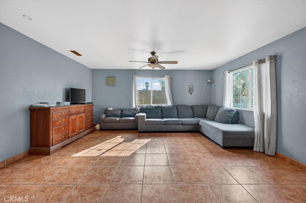705 South C Madera, CA 93638 - Photo 16 of 50 a living room with furniture and a window