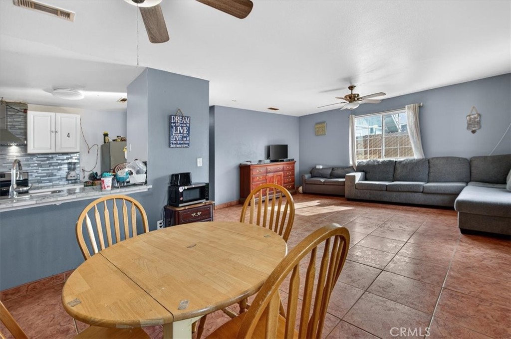 705 South C Madera, CA 93638 - Photo 17 of 50 a living room with furniture and a large window