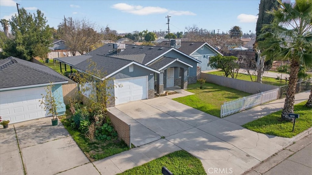 705 South C Madera, CA 93638 - Photo 2 of 50 a view of a house with a yard and potted plants